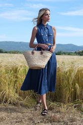 a lady in a lapel denim dress with a belt